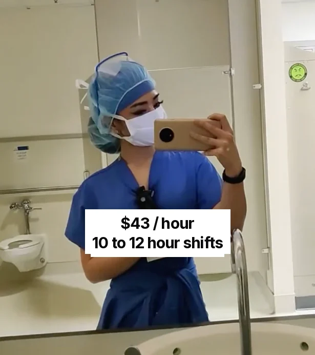 Tawny as a nurse in scrubs, mirror selfie from her nursing days